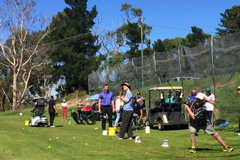 tasmania golf club, image of clinic participants playing golf