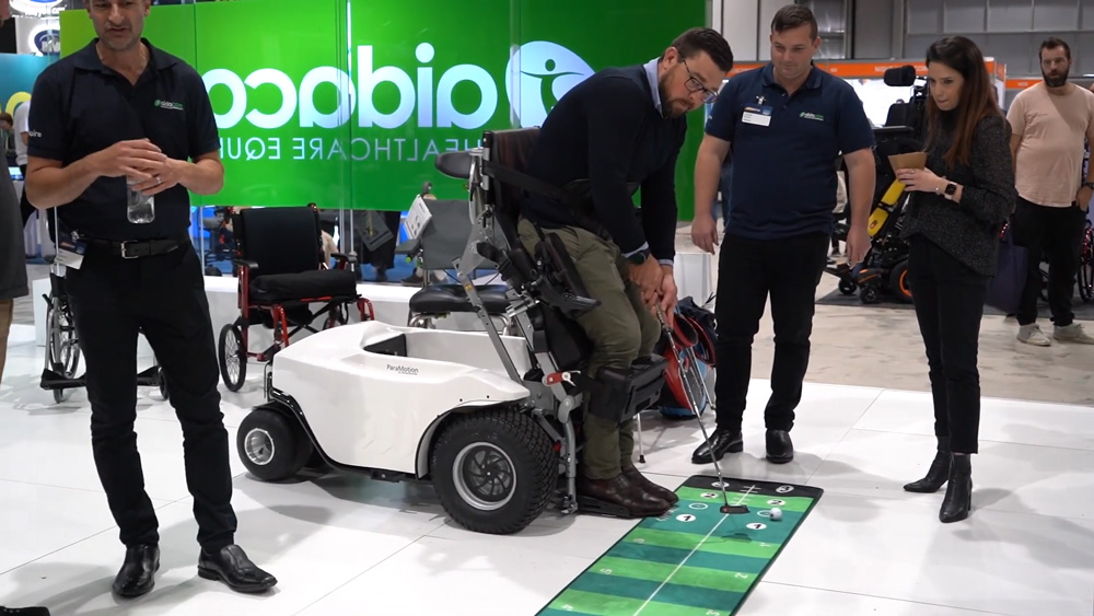 Empower Golf and Aidacare present the new Paramotion Wheelchair at the ATSA Expo in Sydney 2022, image of paramotion wheelchair being demonstrated to attendees